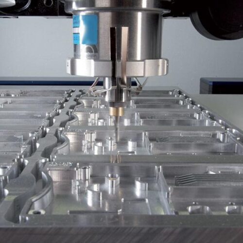 Acrylic sheet being shaped by milling machine